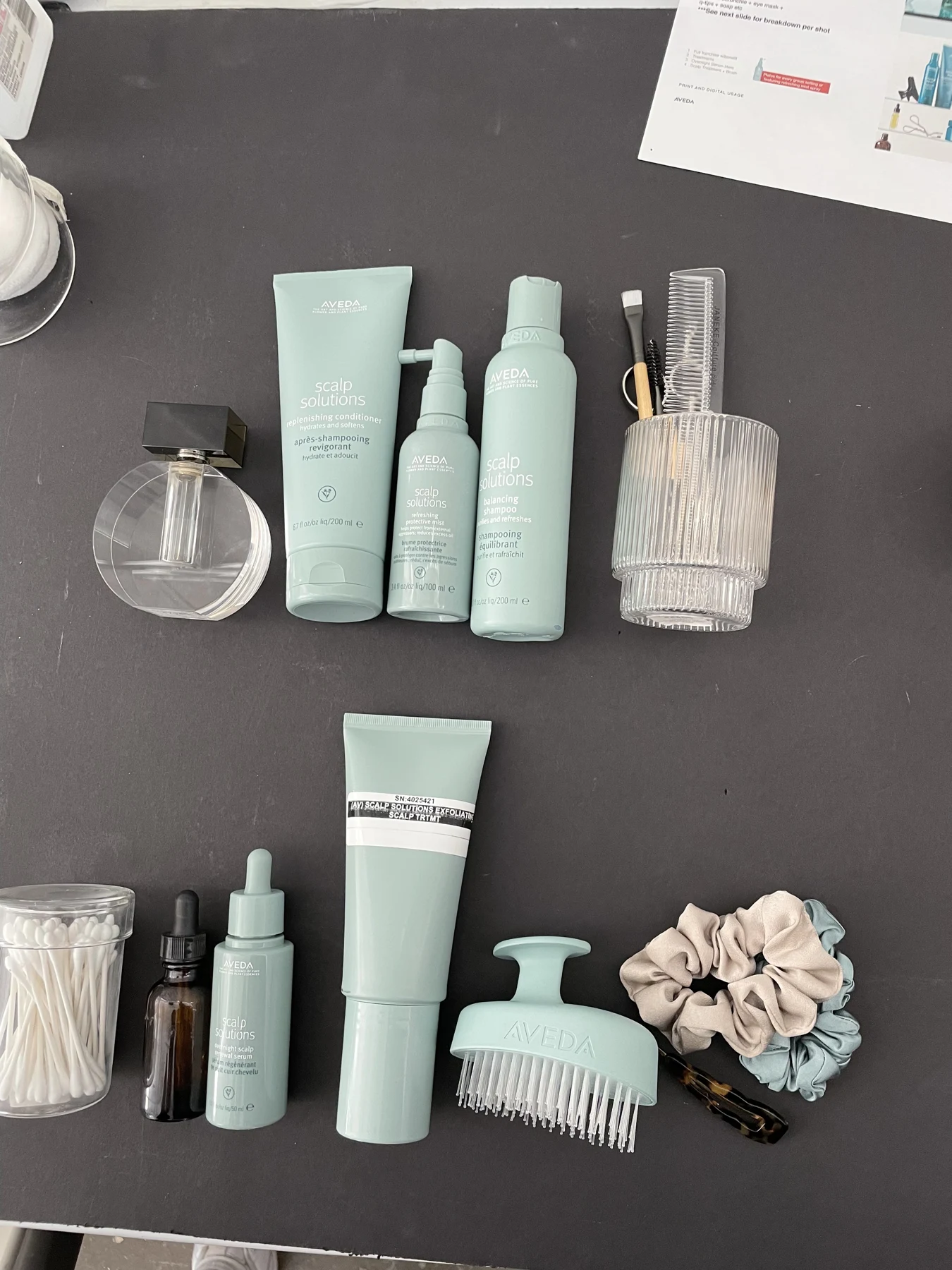 Rachel staging Aveda products for photography